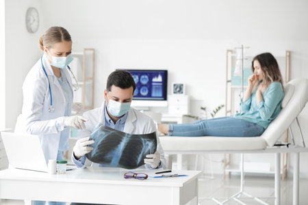 Young doctors with x-ray image of lungs in clinicの写真素材