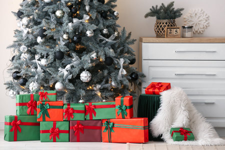 Pouf with gifts and Christmas tree in living roomの写真素材