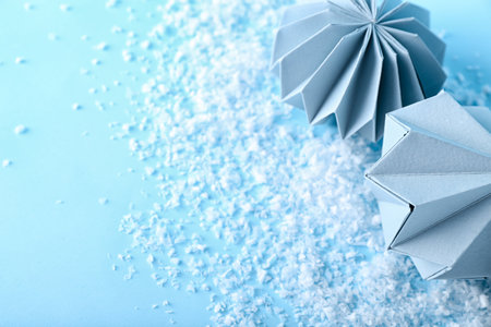 Paper Christmas balls with snow on blue background, closeupの写真素材