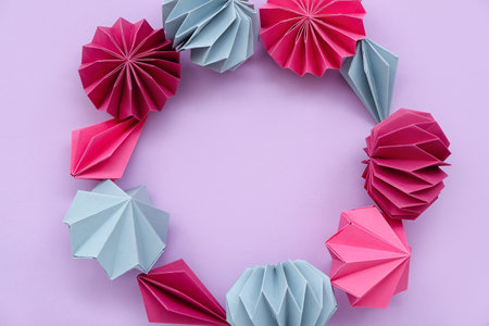 Frame made of paper Christmas balls on lilac backgroundの写真素材