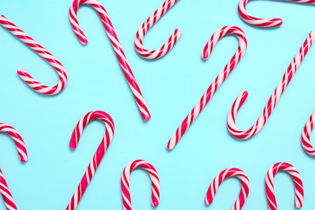 Composition with candy canes on color backgroundの写真素材