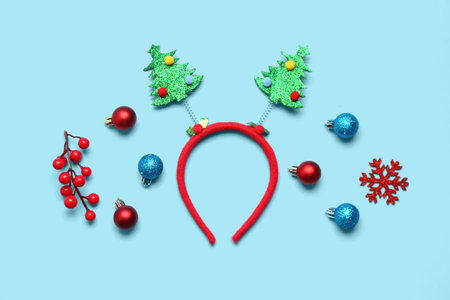 Composition with Christmas headband and different decorations on color backgroundの写真素材