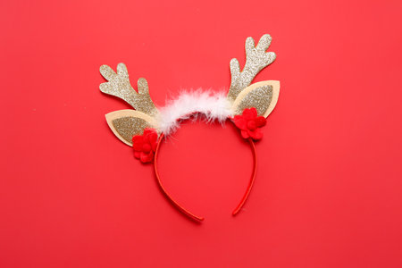 Beautiful Christmas reindeer horns on red backgroundの写真素材