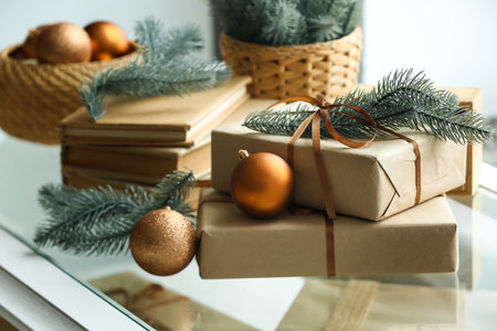 Christmas presents with fir branches and balls on windowsill, closeupの写真素材