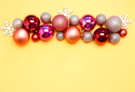 Composition with beautiful Christmas balls on color backgroundの写真素材