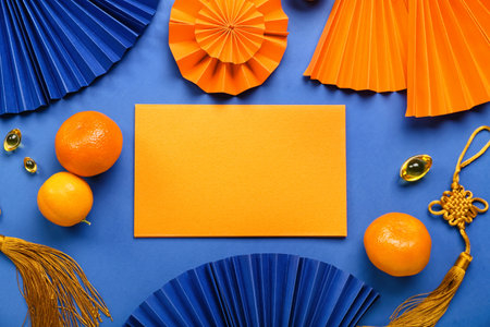 Blank card with tangerines and Chinese symbols on blue background. new year celebrationの写真素材