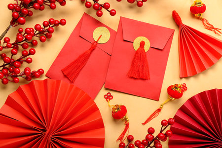 Envelopes with berries and Chinese symbols on beige background. new year celebrationの写真素材