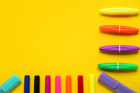 Composition with different markers on yellow backgroundの写真素材
