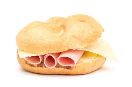 Kaiser roll with ham and cheese on white backgroundの写真素材