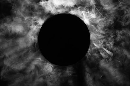 Black circle and smoke on dark background