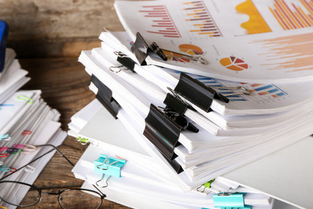 Stack of documents on wooden background, closeupの写真素材