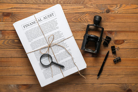 Documents, stationery and stamp on wooden table