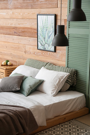 Interior of stylish room with comfortable bedの写真素材