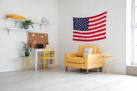Interior of stylish room with modern workplace and USA flagの写真素材