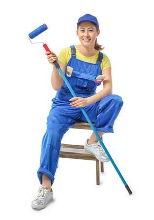 Female painter with roller brush on white backgroundの写真素材