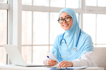 Muslim female doctor working in clinicの写真素材