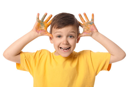 Cute little boy with hands in paint on white backgroundの写真素材