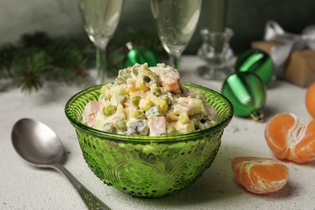 Bowl of Olivier salad on white table, closeupの写真素材