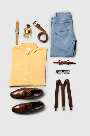 Male clothes and accessories on light backgroundの写真素材