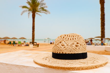 Wicker hat on beach, closeupの写真素材