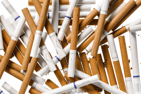 Whole cigarettes as background, top viewの写真素材