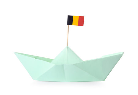 Paper ship and small flag of Belgium on white backgroundの写真素材