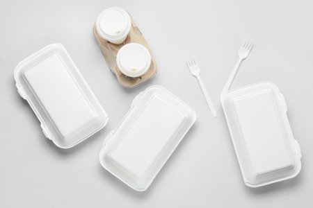 Assortment of food delivery containers on light backgroundの写真素材