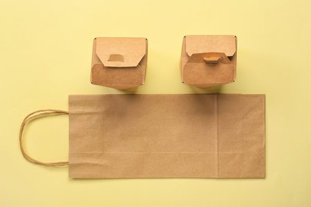 Paper boxes and bags on color backgroundの写真素材