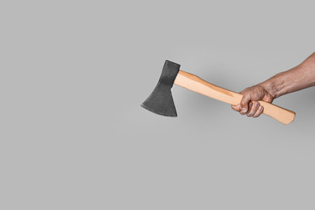Man with ax on gray backgroundの写真素材