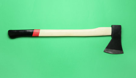 Ax on green background, top viewの写真素材