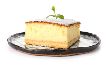 Plate with piece of cheese pie on white backgroundの写真素材