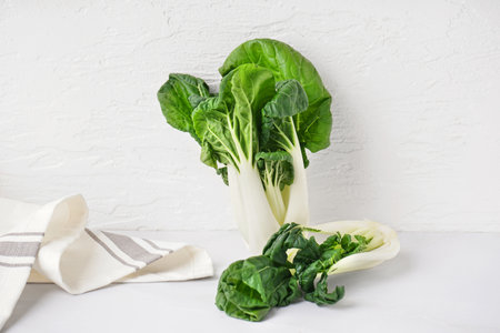 Fresh pak choi cabbage on light table