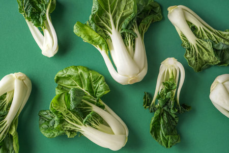 Fresh pak choi cabbages on green backgroundの写真素材