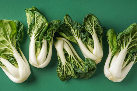 Fresh pak choi cabbages on green background, closeupの写真素材