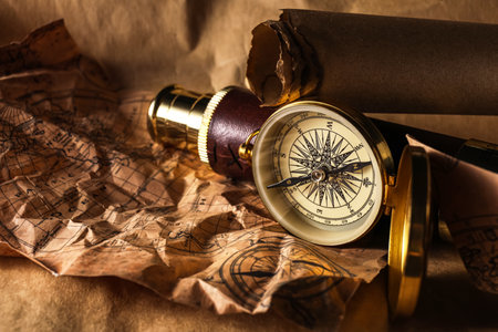 Golden compass with spyglass on world map