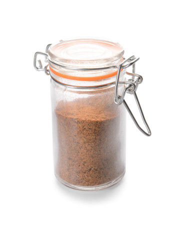 Jar with cinnamon spice on white backgroundの写真素材