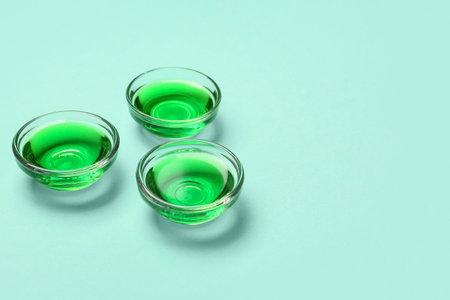 Glasses with matcha tea on blue backgroundの写真素材