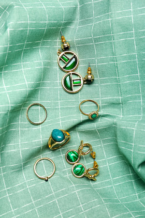 Stylish female jewelry on fabric backgroundの写真素材