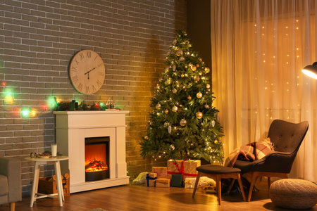 Interior of stylish living room with fireplace decorated for Christmasの写真素材