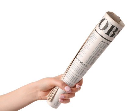 Female hand and newspaper on white backgroundの写真素材