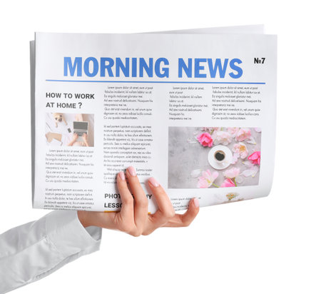 Female hand and newspaper on white backgroundの写真素材