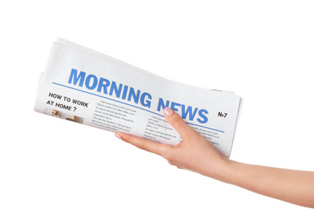 Female hand and newspaper on white backgroundの写真素材