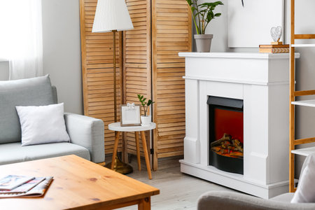 Interior of stylish living room with modern fireplaceの写真素材