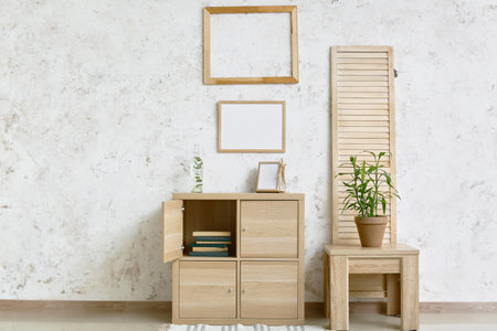 Interior of stylish living room with modern chest of drawers