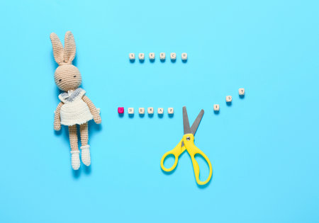 Text SPEECH THERAPIST with toy and scissors on color backgroundの写真素材