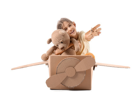 Little girl playing with toys on white backgroundの写真素材