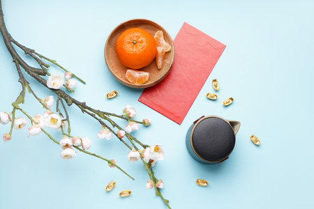 Envelope, mandarin, sakura, teapot and Chinese symbols on blue background. new year celebrationの写真素材