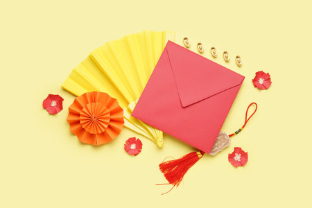 Envelope and Chinese symbols on yellow background. new year celebrationの写真素材