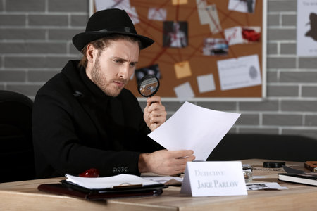 Detective processing evidence in officeの写真素材