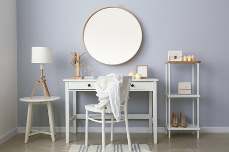 Interior of stylish workplace with mirror